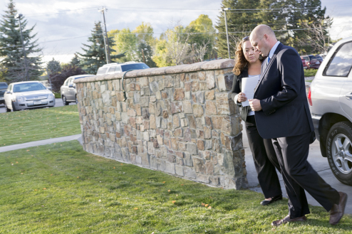 Kathy Weber escorts Democratic United States Congress candidate, John Lewis, through the back door of Riverside Country Club in Bozeman, Montana.